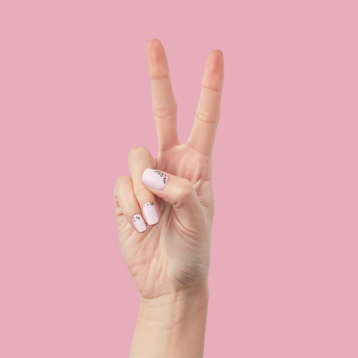 Wild Bouquet - Press-On | Short | Squoval short nails with light pink base and delicate wildflower details on hand against pink background