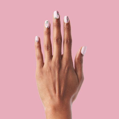 Wild Bouquet - Press-On | Short | Squoval short nails with soft pink base and delicate floral accents on hand against pink background