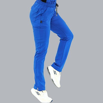 Women’s royal blue scrub pants with 8 functional pockets