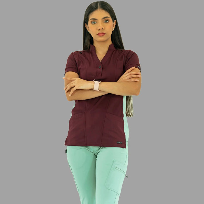 Close-up of pocket and seam details on Women's Top 930 Maroon/Brook Green scrub top