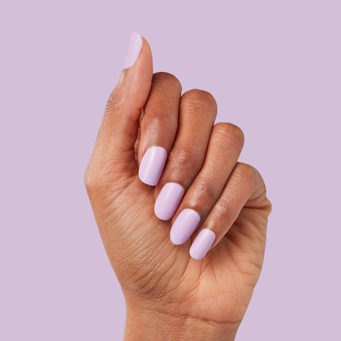 Hand with You're Invited - Press-On | Short | Squoval showing playful lilac purple short squoval press-on manicure