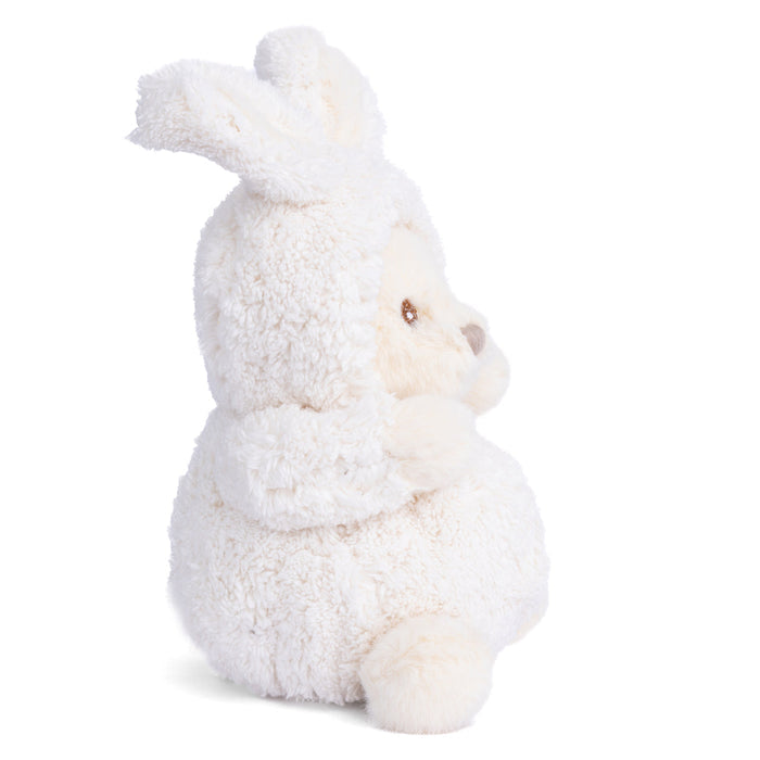 Cream plush bunny side view with floppy ears, stitched face, and cuddly body